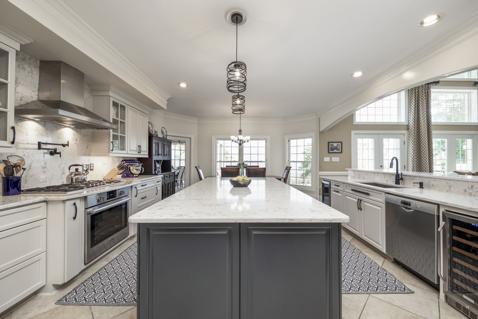 Range wall with custom hood and painted cabinets